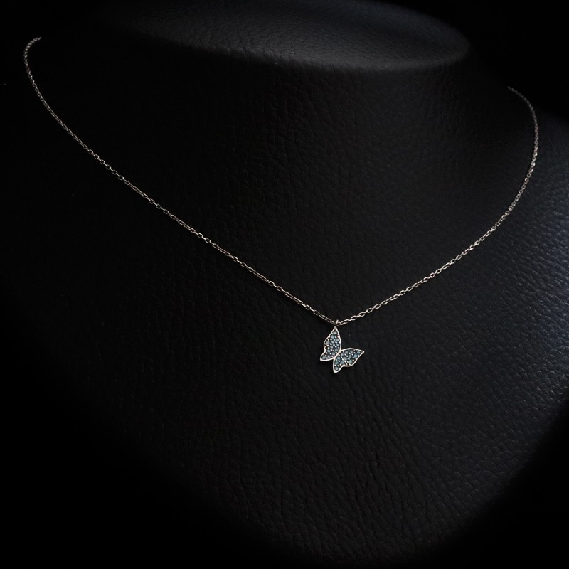 silver butterfly necklace with blue cubic zirconia stones