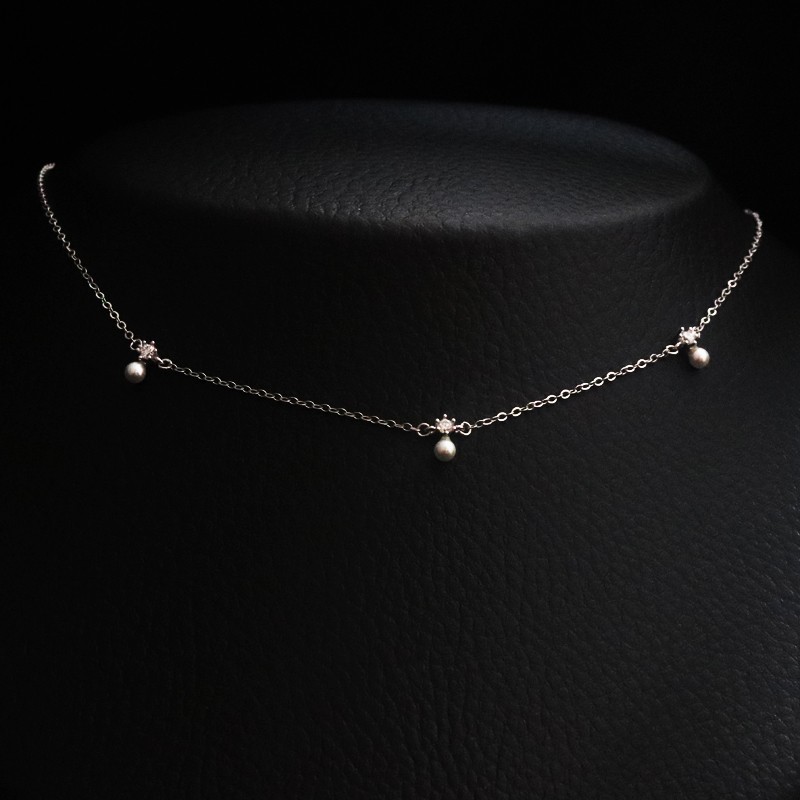 silver necklace with pearls and cubic zirconia stones