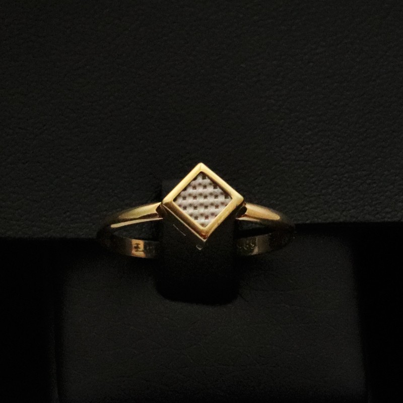 gold ring in the shape of a diamond