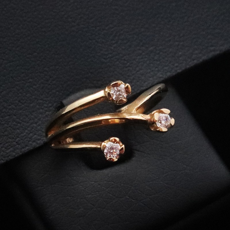 gold ring with three cubic zirconia stones