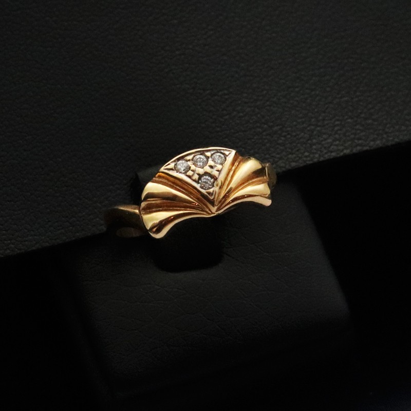 gold ring with four cubic zirconia stones