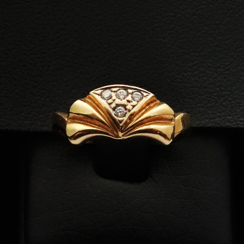 gold ring with four cubic zirconia stones