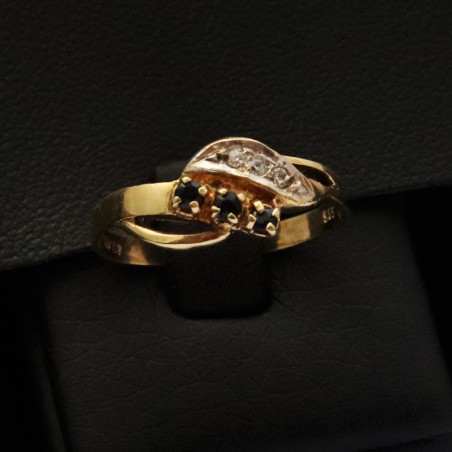 gold ring with black onyx stones and cubic zirconia stones
