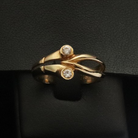 gold ring with two cubic zirconia stones