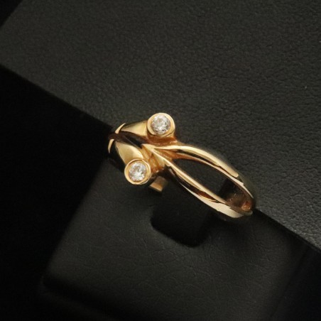 gold ring with two cubic zirconia stones