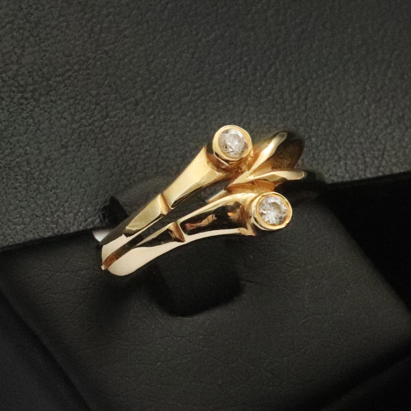 gold ring with two cubic zirconia stones