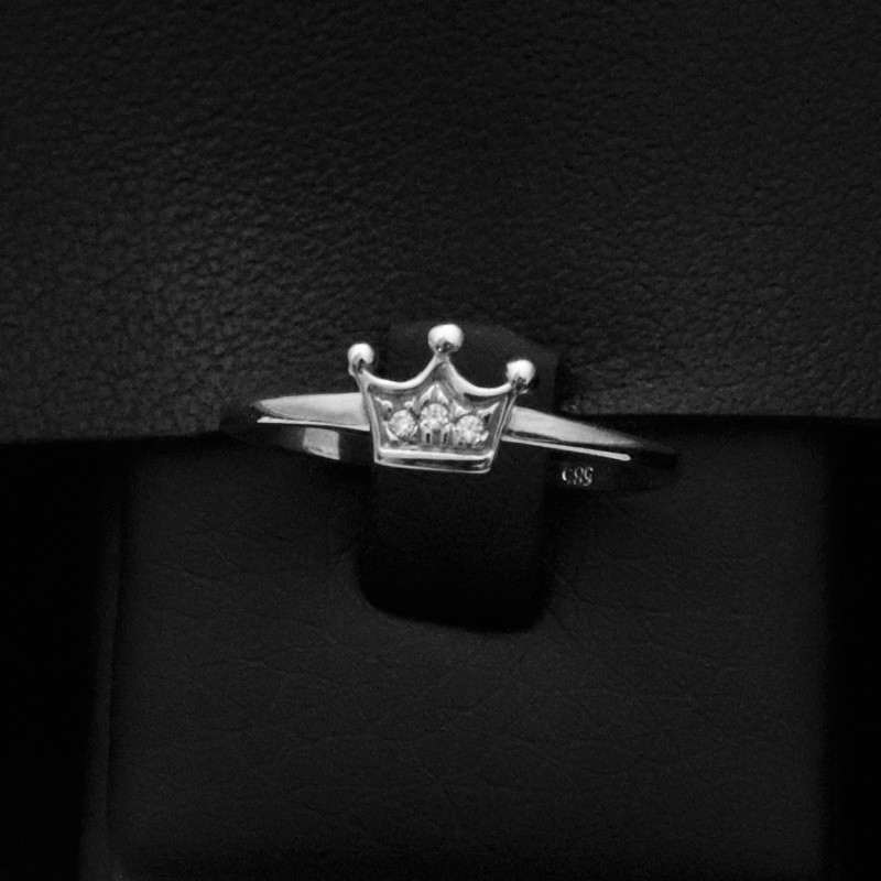 white gold ring with crown