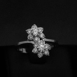 white gold ring in daisy design and cubic zirconia stones