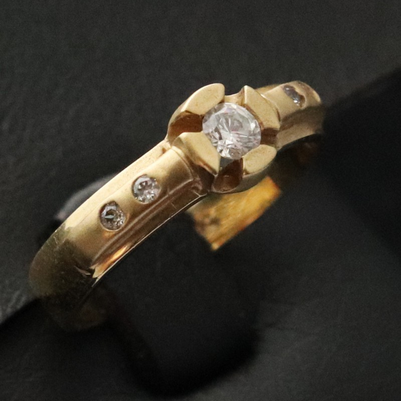 woman yellow gold ring with cubic zirconia