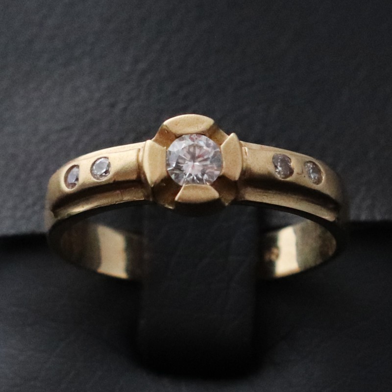 woman yellow gold ring with cubic zirconia