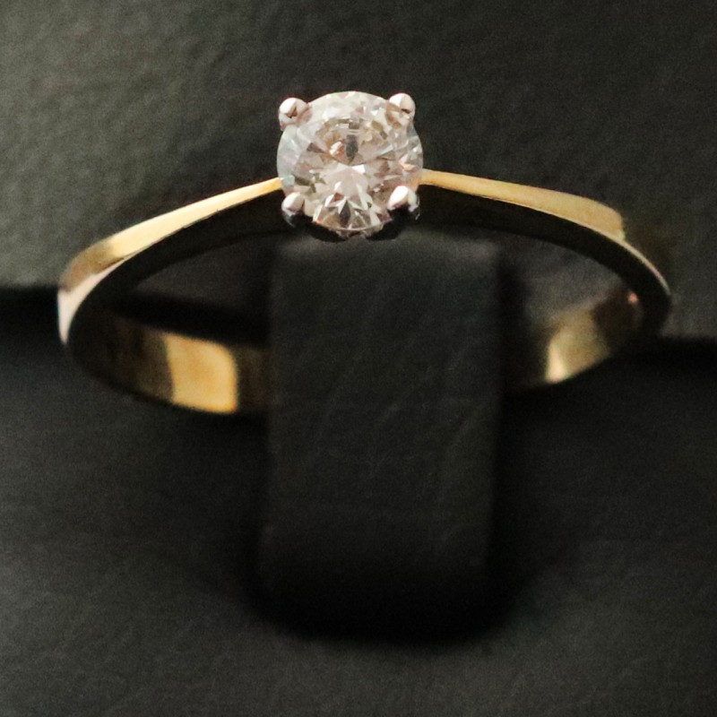 white and yellow gold ring with cubic zirconia