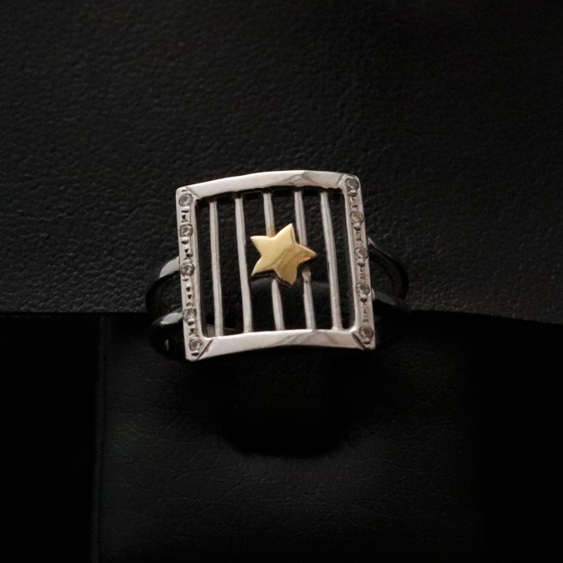 white gold ring with star and cubic zirconia stones