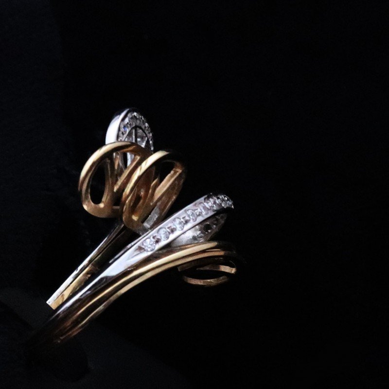 asymmetric gold ring with zircon stones