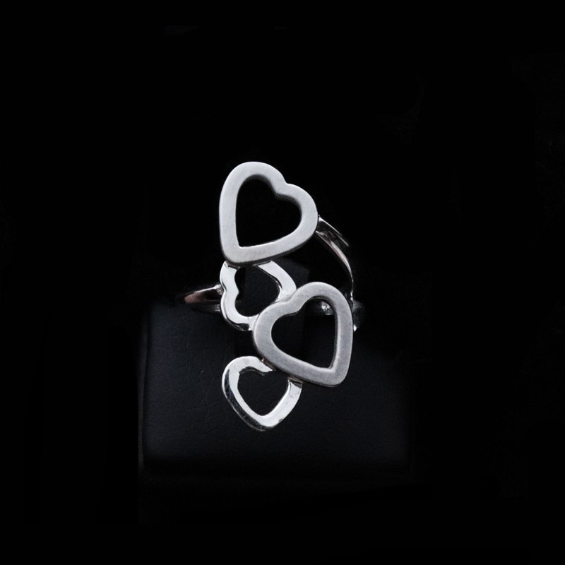 white gold ring with hearts