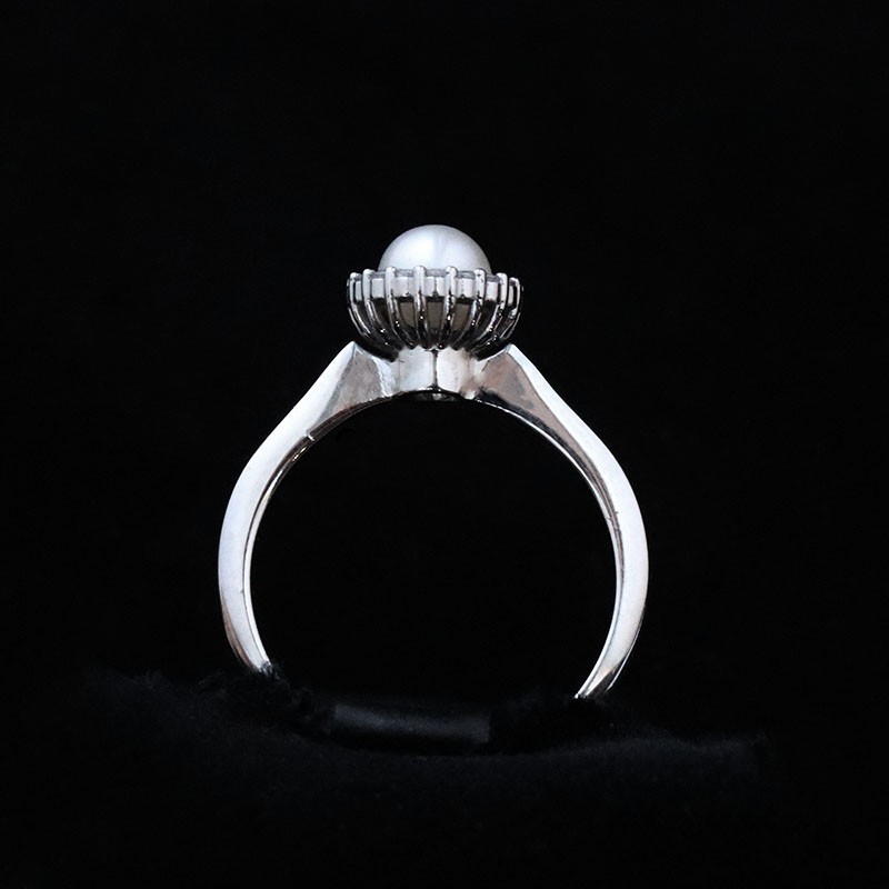 white gold ring with pearl and cubic zirconia
