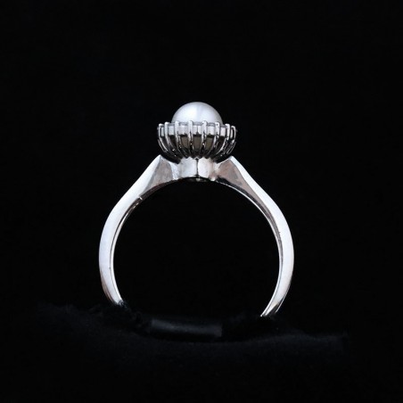 white gold ring with pearl and cubic zirconia