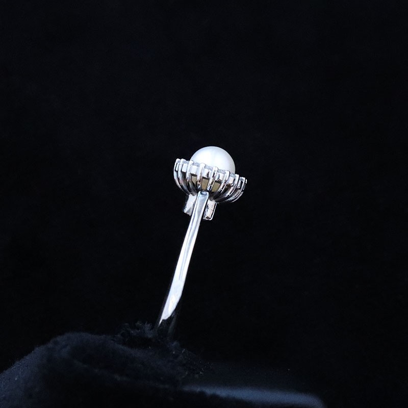 white gold ring with pearl and cubic zirconia