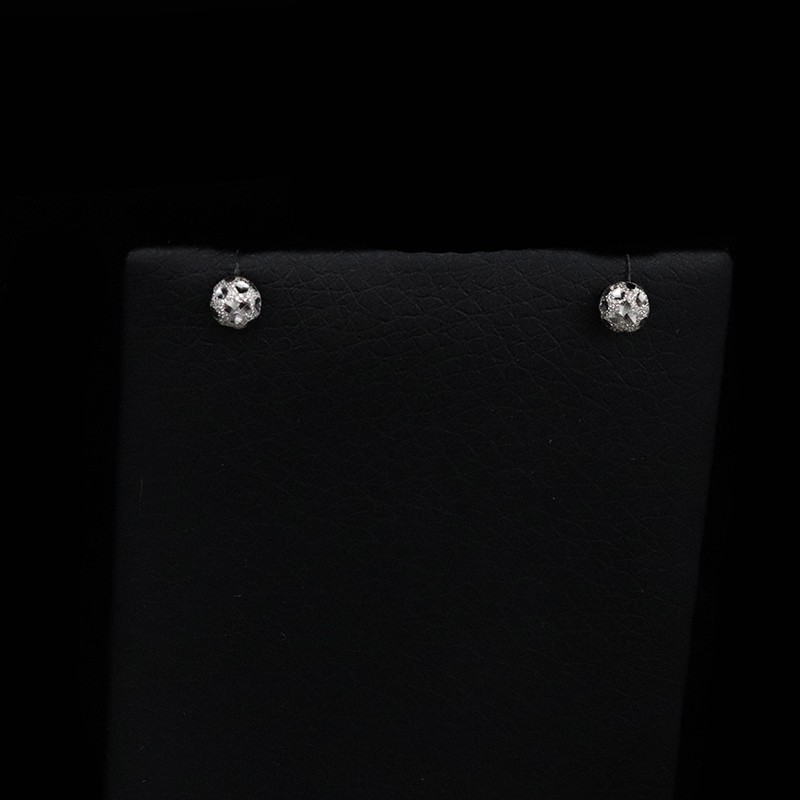 white gold earrings in the shape of a ball