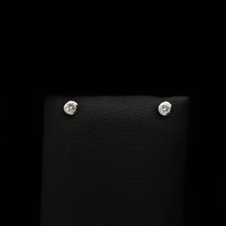 White gold earrings with zircon stones