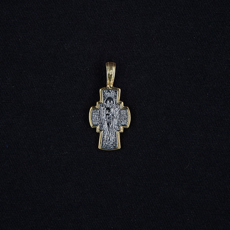 breasted gilded cross