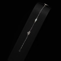 white gold bracelet with car and eye