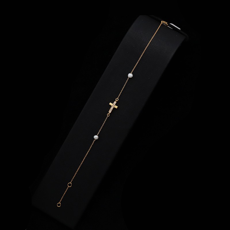 gold bracelet with cross