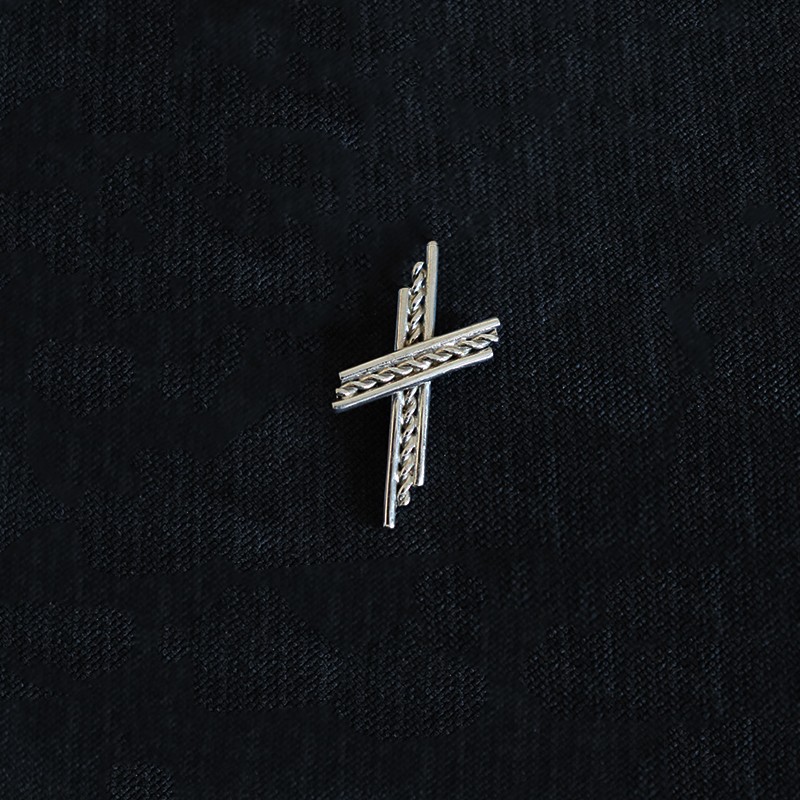 silver knitted cross