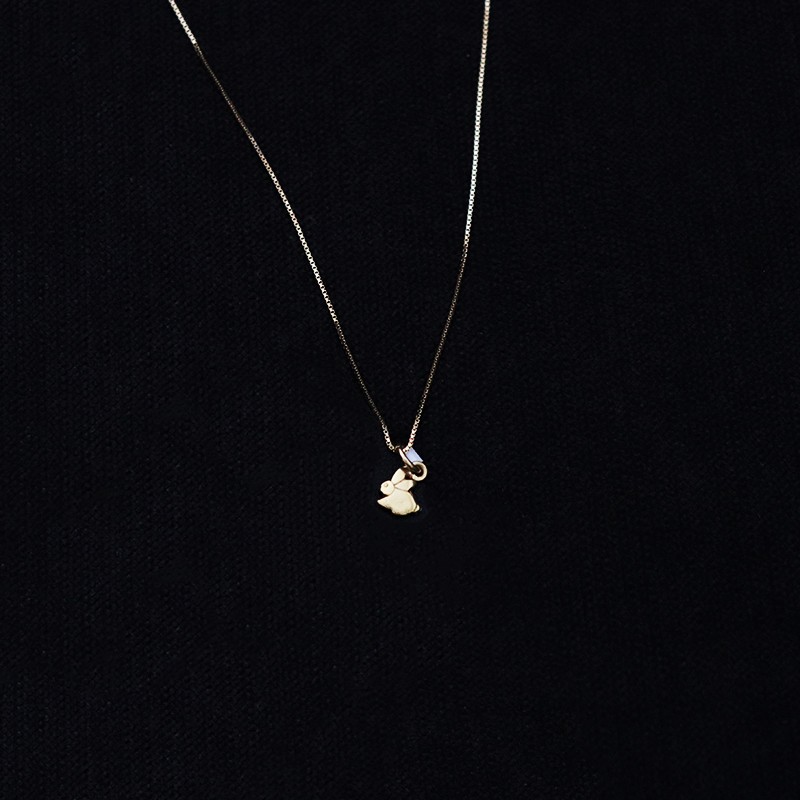 gold pendant with bunny