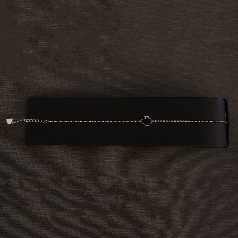 silver bracelet with cross and zircon