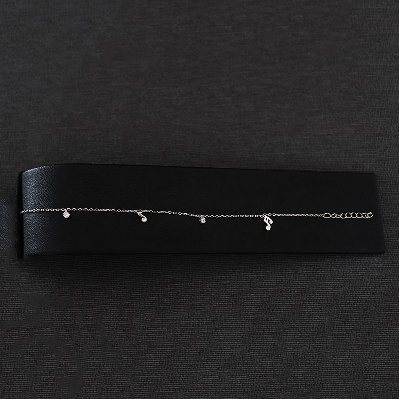 silver bracelet with notes