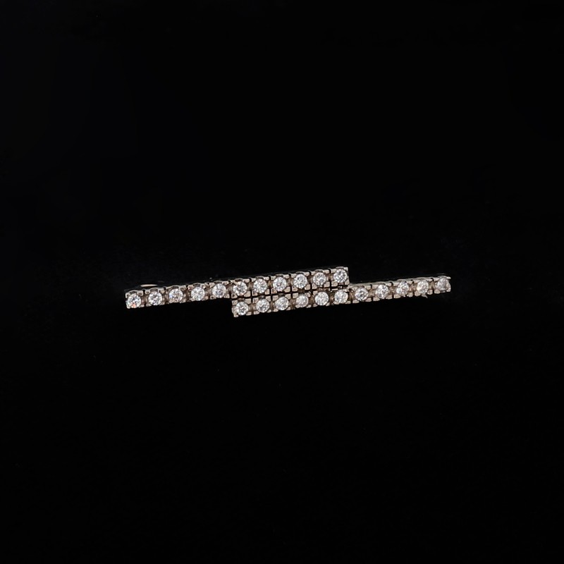 female silver pin with cubic zirconia
