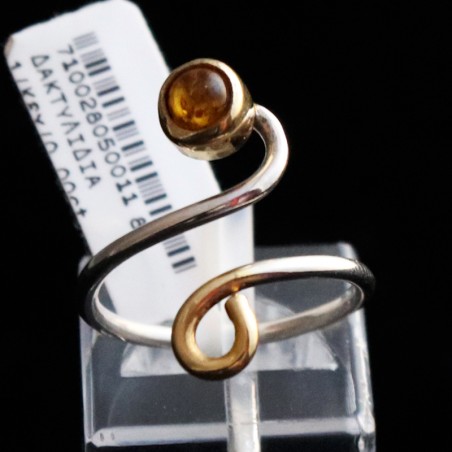 ring in silver opening with round amber