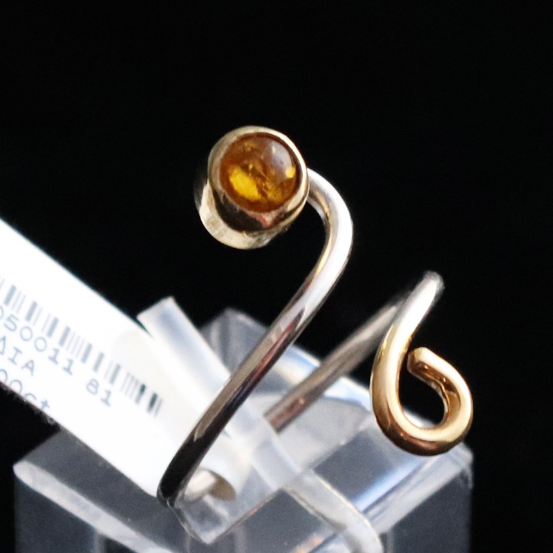 ring in silver opening with round amber