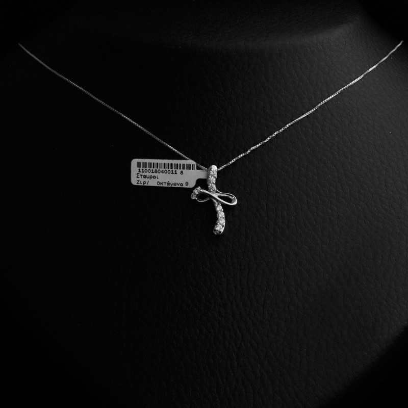 silver cross necklace with nine cubic zirconia stones